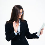 Businesswoman-showing-greeting-gesture-on-web-camera_resized